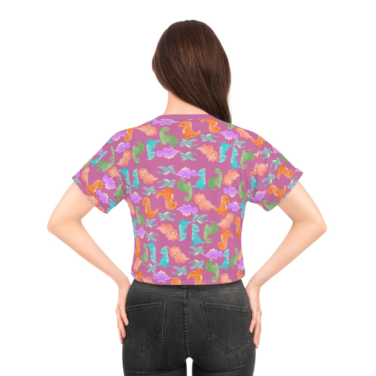 Whimsical Dinosaur Crop Tee for Kids Cheerful Summer Top Fun Gift for Dinosaur Lovers Playful TShirt for Birthdays Trendy Casual Wear Rainbow Dinos Light Pink